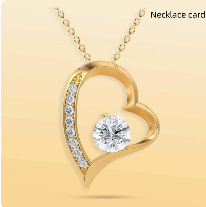 Coffret cadeau Rose Éternelle avec ourson tournant, rose préservée et collier délicat dans boîte luxueuse